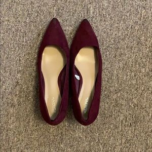 Maroon closed, pointed toed heels (about 1-1.5 in)